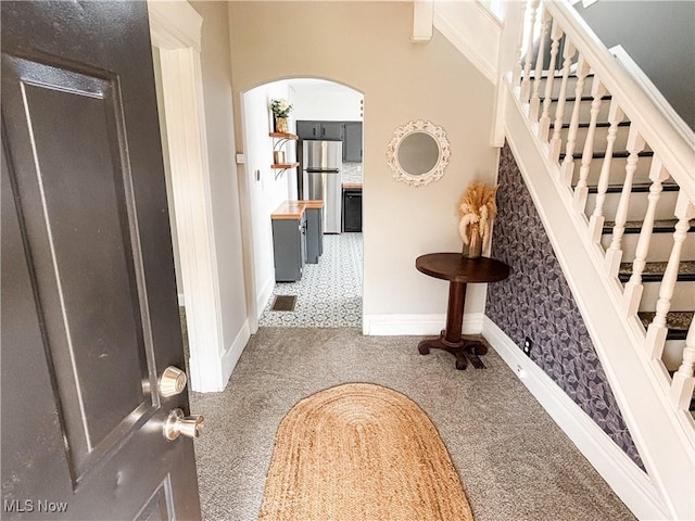 1021 12th Ave, Vienna, WV 26105 - carpeted entryway with arched walkways and stairs