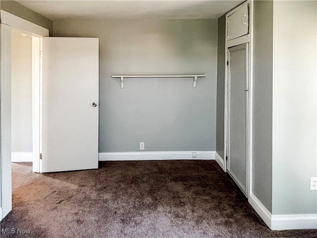 1021 12th Ave, Vienna, WV 26105 - unfurnished bedroom with carpet and baseboards