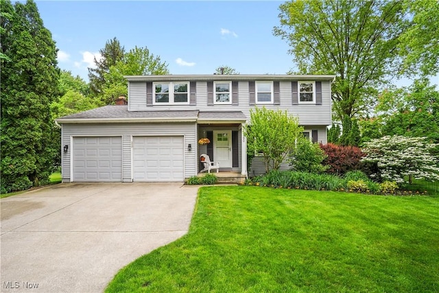 4190 Springdale Rd, Stow, OH 44224 - traditional home with driveway, a front lawn, and an attached garage