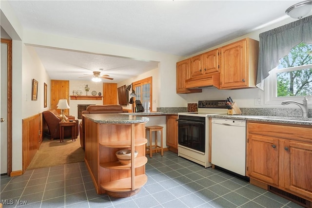4190 Springdale Rd, Stow, OH 44224 - kitchen featuring white dishwasher, electric range oven, open shelves, open floor plan, and under cabinet range hood