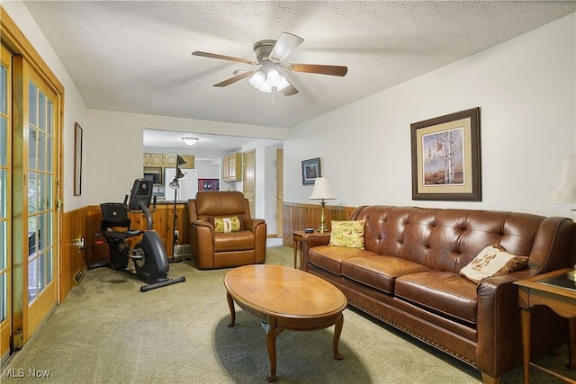 4190 Springdale Rd, Stow, OH 44224 - living room featuring light colored carpet, a wainscoted wall, a ceiling fan, wooden walls, and a textured ceiling