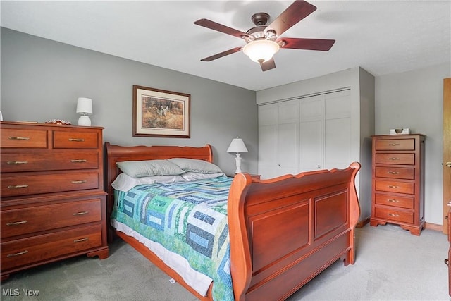 4190 Springdale Rd, Stow, OH 44224 - bedroom with light carpet, a closet, and a ceiling fan