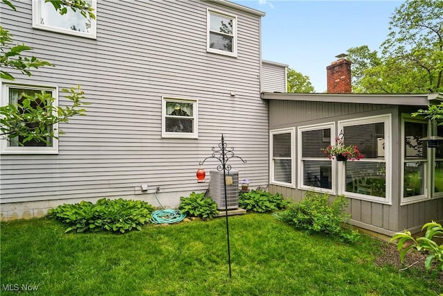 4190 Springdale Rd, Stow, OH 44224 - view of property exterior featuring a chimney and a lawn