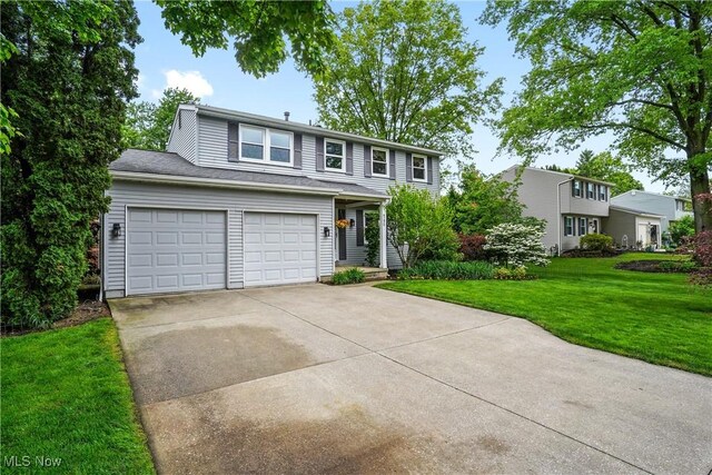 4190 Springdale Rd, Stow, OH 44224 - traditional-style home featuring concrete driveway and a front lawn