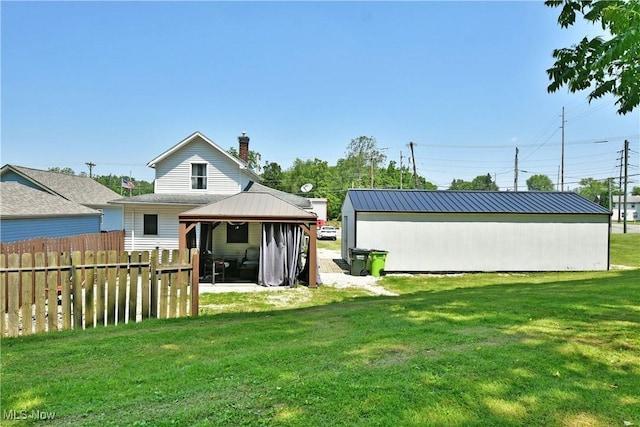252 E Main St, Newton Falls, OH 44444 - back of house with a gazebo and a chimney