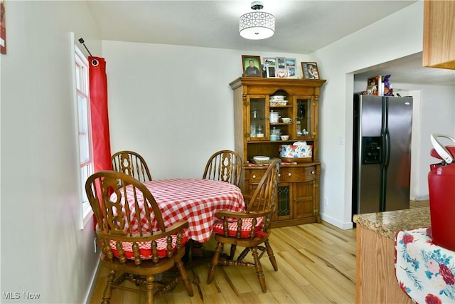 252 E Main St, Newton Falls, OH 44444 - dining area with light wood-type flooring and baseboards