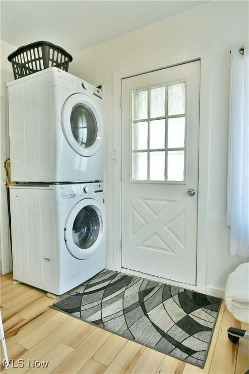 252 E Main St, Newton Falls, OH 44444 - laundry room featuring stacked washer / drying machine and light wood-style floors