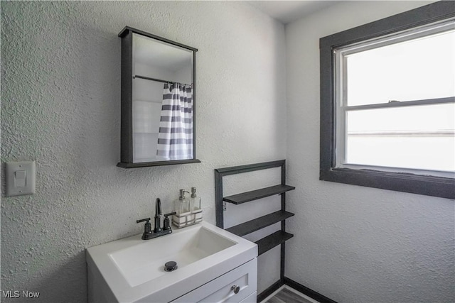 1384 Stark Ave SW, Canton, OH 44706 - full bathroom with vanity and a textured wall