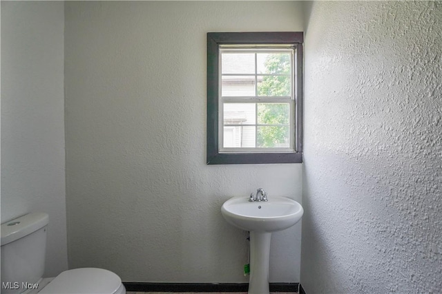 1384 Stark Ave SW, Canton, OH 44706 - half bathroom featuring toilet and a sink