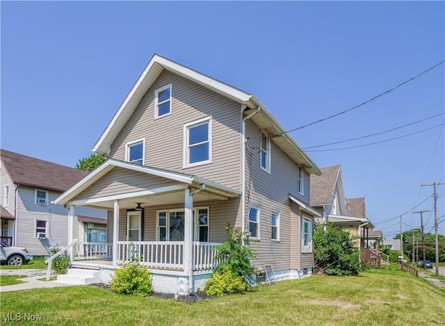 1384 Stark Ave SW, Canton, OH 44706 - view of front facade featuring covered porch and a front lawn