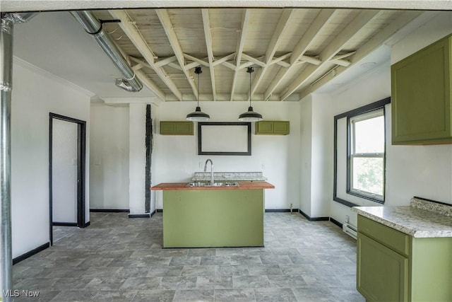 1384 Stark Ave SW, Canton, OH 44706 - kitchen featuring wooden counters, stone finish floors, green cabinetry, a kitchen island with sink, and a baseboard radiator