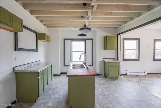 1384 Stark Ave SW, Canton, OH 44706 - kitchen with green cabinetry, healthy amount of natural light, a baseboard heating unit, and a kitchen island with sink