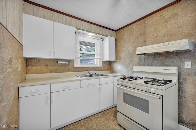 654 Van Everett Ave, Akron, OH 44306 - kitchen with white gas range, under cabinet range hood, crown molding, tile walls, and light countertops