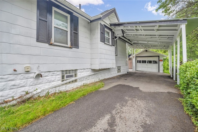 654 Van Everett Ave, Akron, OH 44306 - view of property exterior with an outbuilding, driveway, and a carport