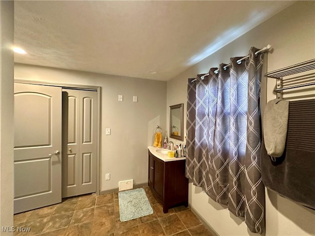 556 Moherman Ave, Youngstown, OH 44509 - bathroom featuring vanity and baseboards
