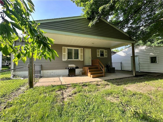 556 Moherman Ave, Youngstown, OH 44509 - rear view of house featuring a patio area