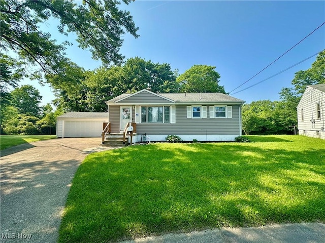 556 Moherman Ave, Youngstown, OH 44509 - view of front of home featuring an outdoor structure, a detached garage, and a front lawn