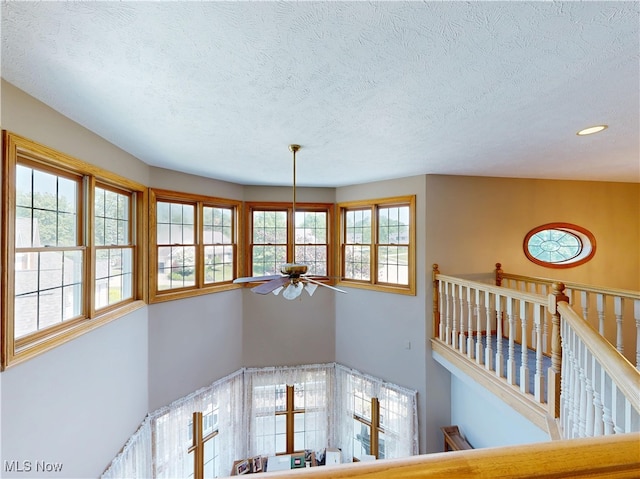 35005 Lisle Ct, Willoughby, OH 44094 - stairs featuring a ceiling fan, a textured ceiling, and recessed lighting