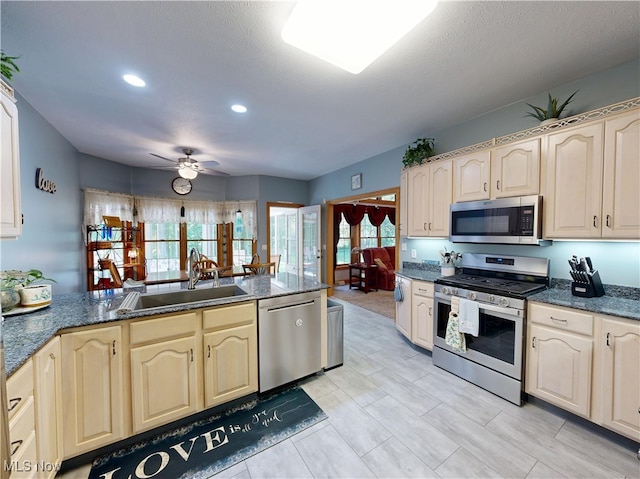 35005 Lisle Ct, Willoughby, OH 44094 - kitchen with stainless steel appliances, ceiling fan, recessed lighting, healthy amount of natural light, and a peninsula