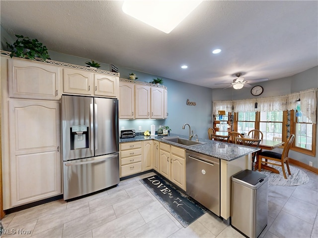 35005 Lisle Ct, Willoughby, OH 44094 - kitchen featuring stainless steel appliances, a peninsula, ceiling fan, recessed lighting, and light tile patterned floors