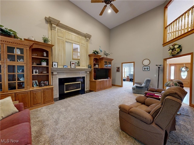 35005 Lisle Ct, Willoughby, OH 44094 - living room with carpet flooring, high vaulted ceiling, ceiling fan, and a fireplace with flush hearth