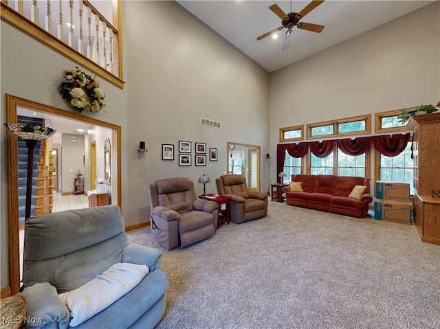 35005 Lisle Ct, Willoughby, OH 44094 - carpeted living room featuring a towering ceiling and a ceiling fan