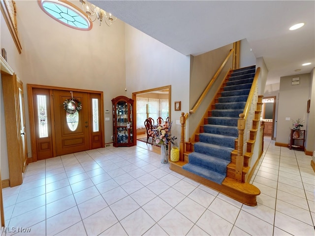 35005 Lisle Ct, Willoughby, OH 44094 - foyer entrance featuring light tile patterned floors, stairs, a towering ceiling, plenty of natural light, and recessed lighting