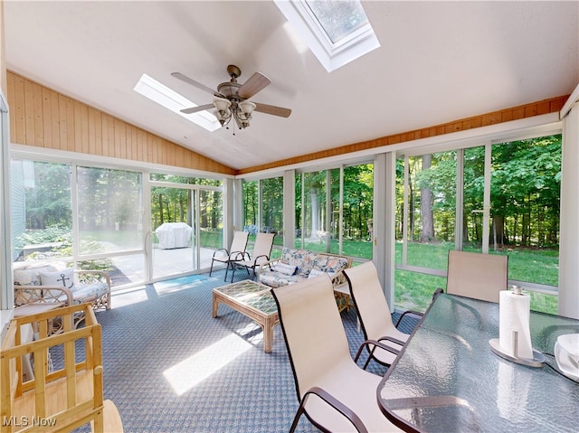 35005 Lisle Ct, Willoughby, OH 44094 - sunroom featuring a skylight, vaulted ceiling, a ceiling fan, and outdoor dining space