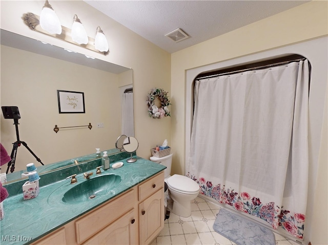 35005 Lisle Ct, Willoughby, OH 44094 - bathroom with vanity, a textured ceiling, and tile patterned floors