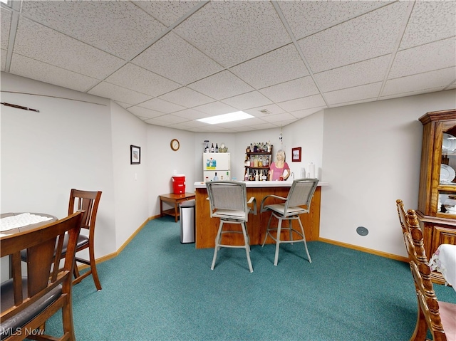 35005 Lisle Ct, Willoughby, OH 44094 - indoor dry bar with a drop ceiling, carpet, and freestanding refrigerator