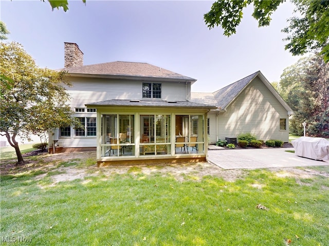 35005 Lisle Ct, Willoughby, OH 44094 - rear view of property featuring a sunroom, a chimney, a yard, and a patio area