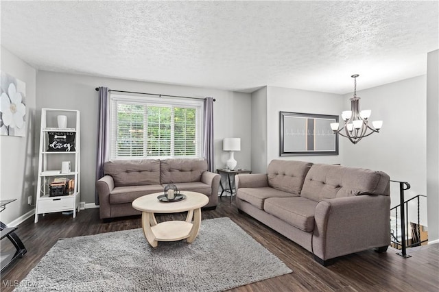 3247 Brooklawn Dr, Norton, OH 44203 - living area with a chandelier, dark wood finished floors, and a textured ceiling