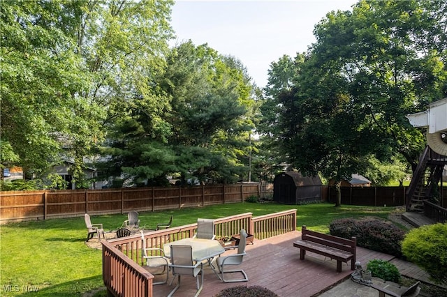 3247 Brooklawn Dr, Norton, OH 44203 - wooden terrace with a storage shed, a fenced backyard, stairway, and outdoor dining area