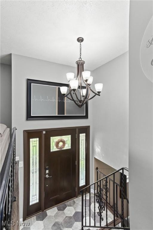 3247 Brooklawn Dr, Norton, OH 44203 - foyer entrance featuring a chandelier