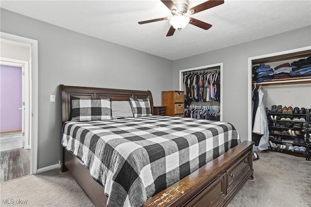 3247 Brooklawn Dr, Norton, OH 44203 - bedroom with light carpet, two closets, and ceiling fan