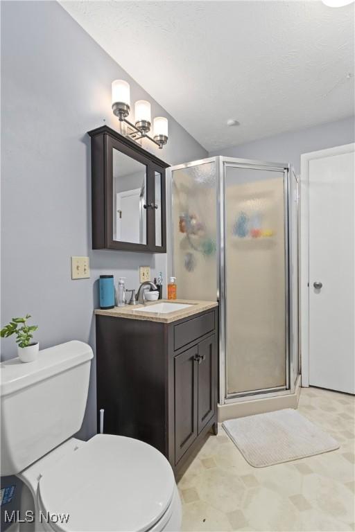 3247 Brooklawn Dr, Norton, OH 44203 - full bathroom featuring vanity and a shower stall