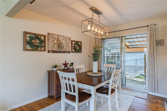 2880 Hetzel Dr, Parma, OH 44134 - dining space featuring wood finished floors and a chandelier