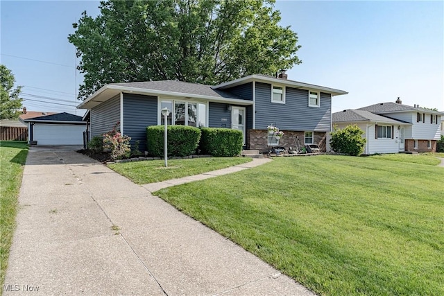 2880 Hetzel Dr, Parma, OH 44134 - split level home with an outdoor structure, a detached garage, and a front lawn