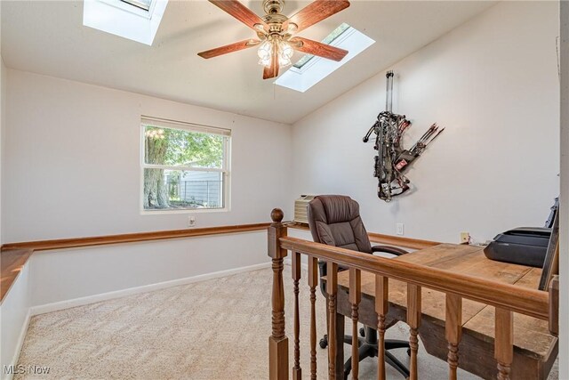 2880 Hetzel Dr, Parma, OH 44134 - carpeted home office with a skylight, vaulted ceiling, and ceiling fan