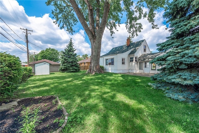 10212 Grace Ave, Garfield Heights, OH 44125 - view of grassy yard featuring a storage unit