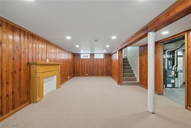 10212 Grace Ave, Garfield Heights, OH 44125 - below grade area with wooden walls, stairway, light carpet, heating unit, and recessed lighting