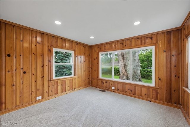 10212 Grace Ave, Garfield Heights, OH 44125 - carpeted empty room with recessed lighting and wood walls