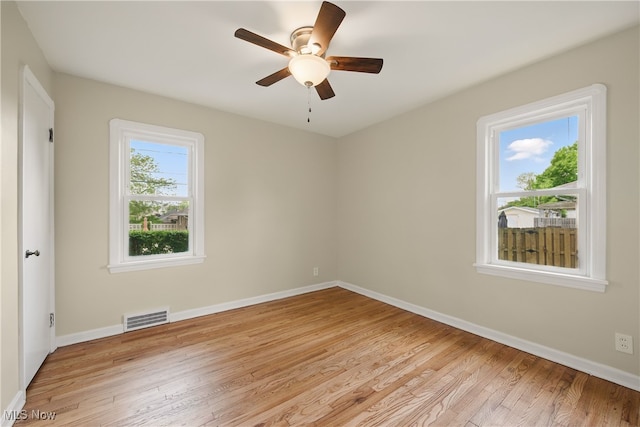 10212 Grace Ave, Garfield Heights, OH 44125 - empty room featuring light wood finished floors and a ceiling fan