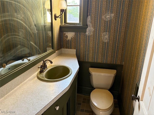 989 Orchard Hill Cir, Massillon, OH 44646 - half bathroom featuring wallpapered walls and vanity