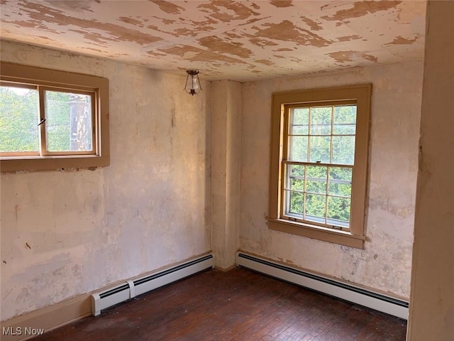989 Orchard Hill Cir, Massillon, OH 44646 - empty room with a baseboard radiator and dark wood-style flooring