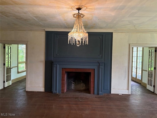 989 Orchard Hill Cir, Massillon, OH 44646 - detailed view of a chandelier, wood finished floors, and a large fireplace