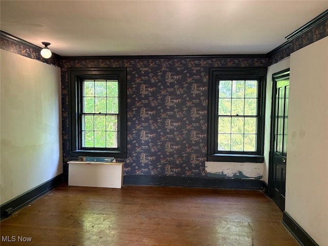 989 Orchard Hill Cir, Massillon, OH 44646 - empty room with wood finished floors and wallpapered walls