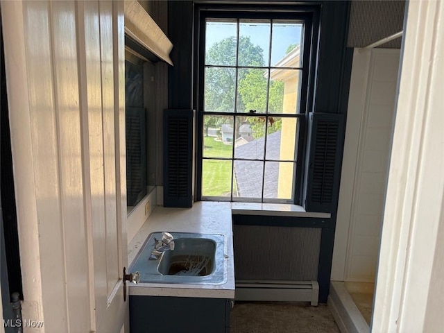 989 Orchard Hill Cir, Massillon, OH 44646 - bathroom with a baseboard radiator, vanity, and a shower