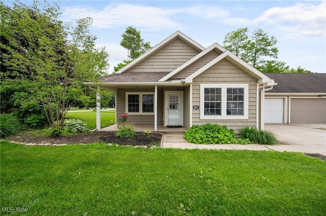 3031 Logan Ln Unit 1, Rock Creek, OH 44084 - view of front of house with covered porch, a front yard, driveway, a garage, and a shingled roof