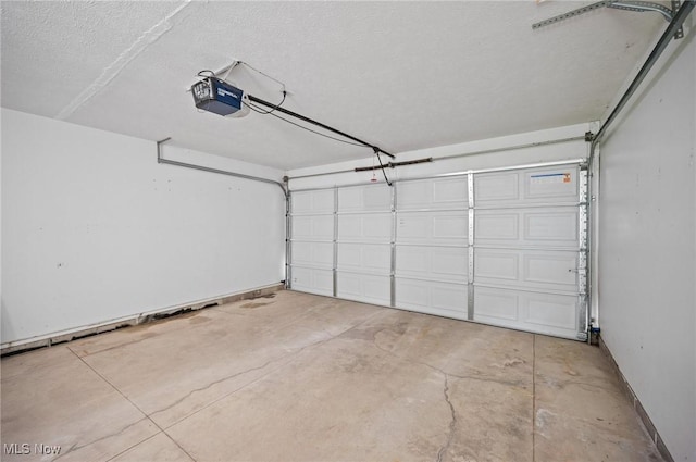 3031 Logan Ln Unit 1, Rock Creek, OH 44084 - garage featuring a garage door opener and baseboards